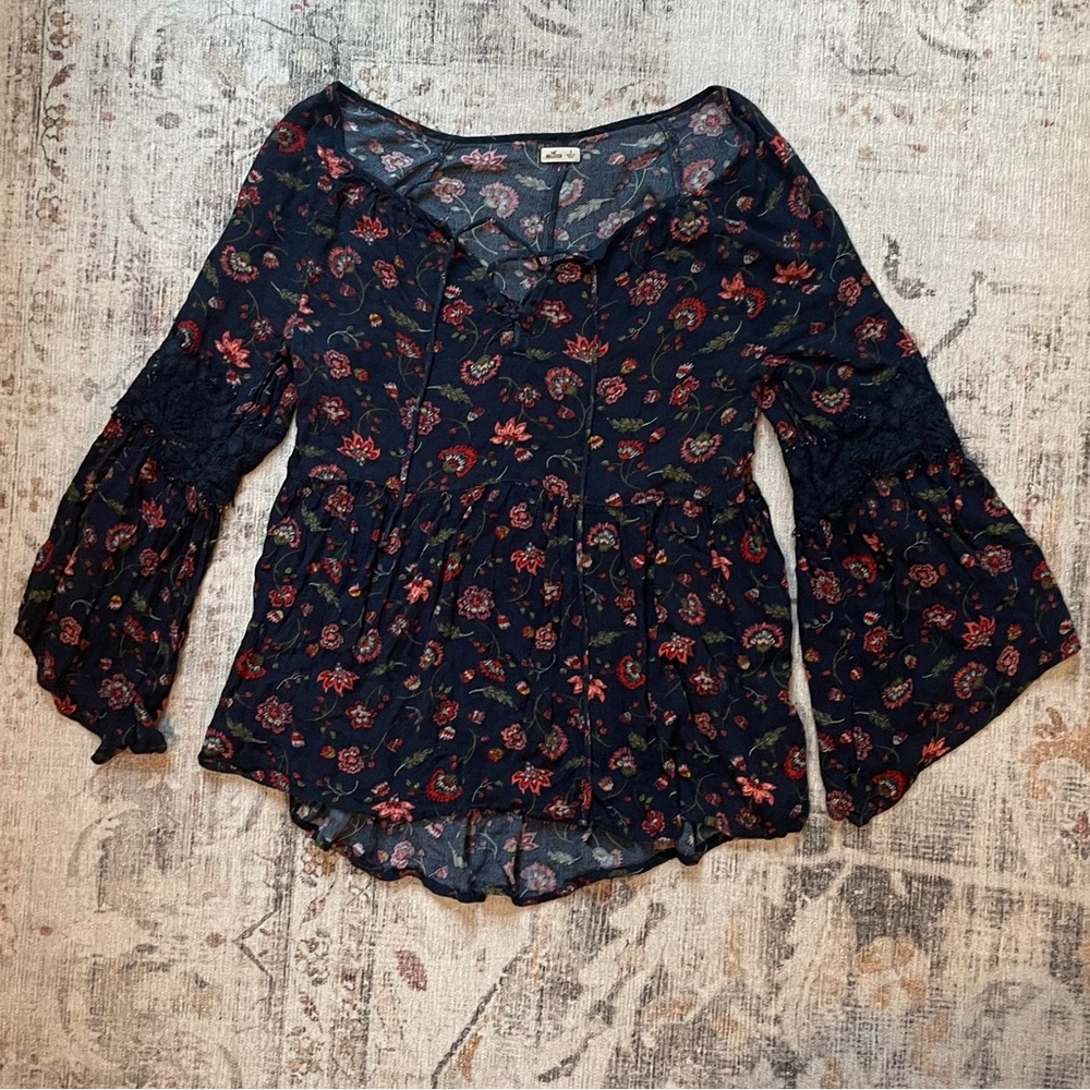 Navy and red floral print blouse with bell sleeves and lace detailing
